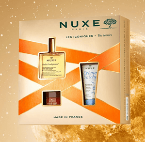 NUXE kozmetik set me parfum, krem dhe serum për kujdesin e lëkurës.
