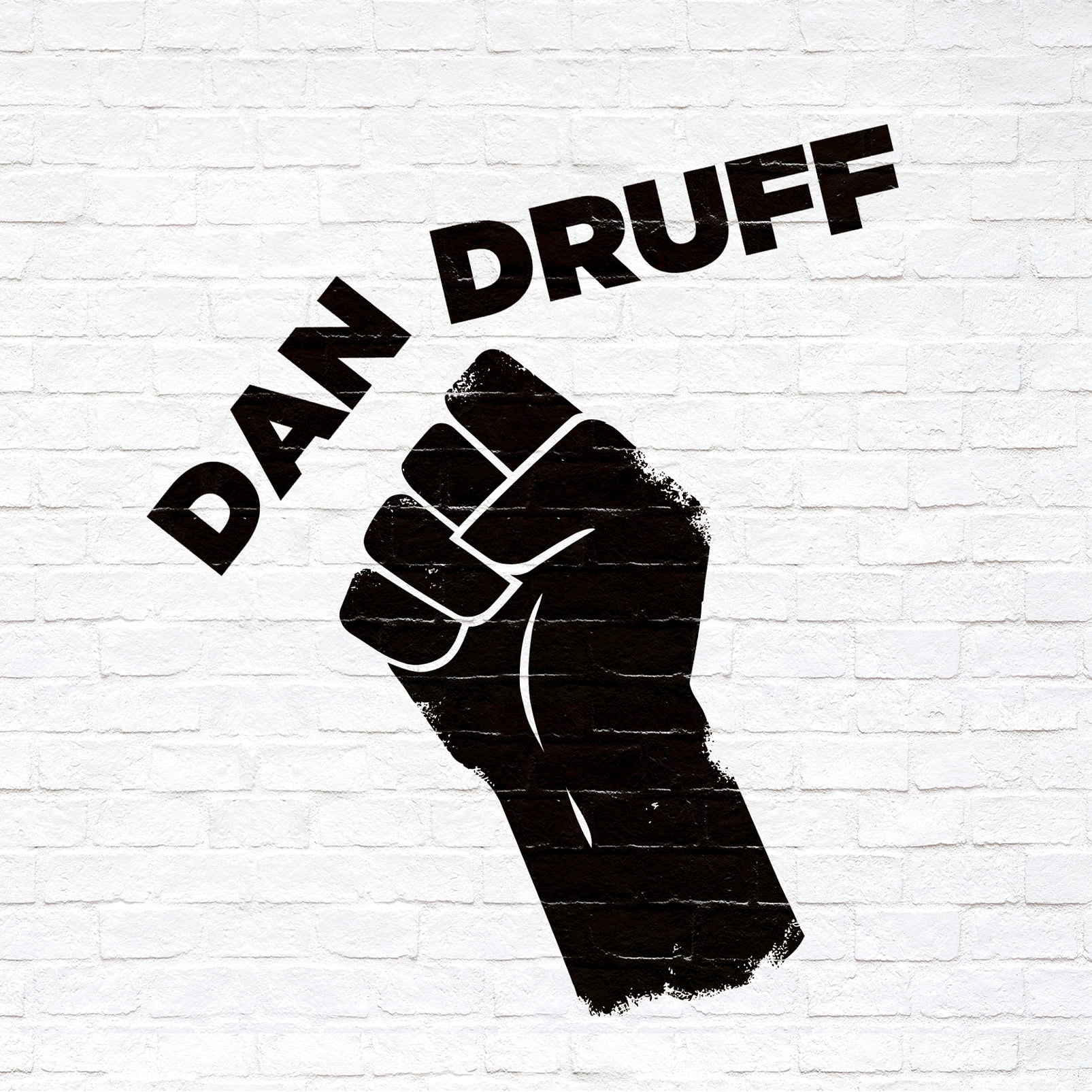 Duhan Druff logo me dorë ngritur dhe tekstin 'DAN DRUFF' në sfond të murit të bardhë.