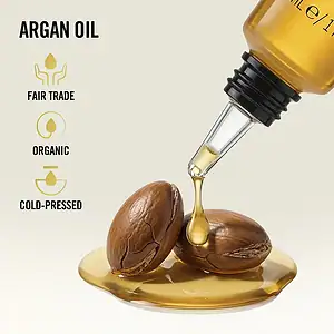 Produkt i kondicionerit për flokë me vaj argan dhe teksturë të butë dhe të shëndetshme.